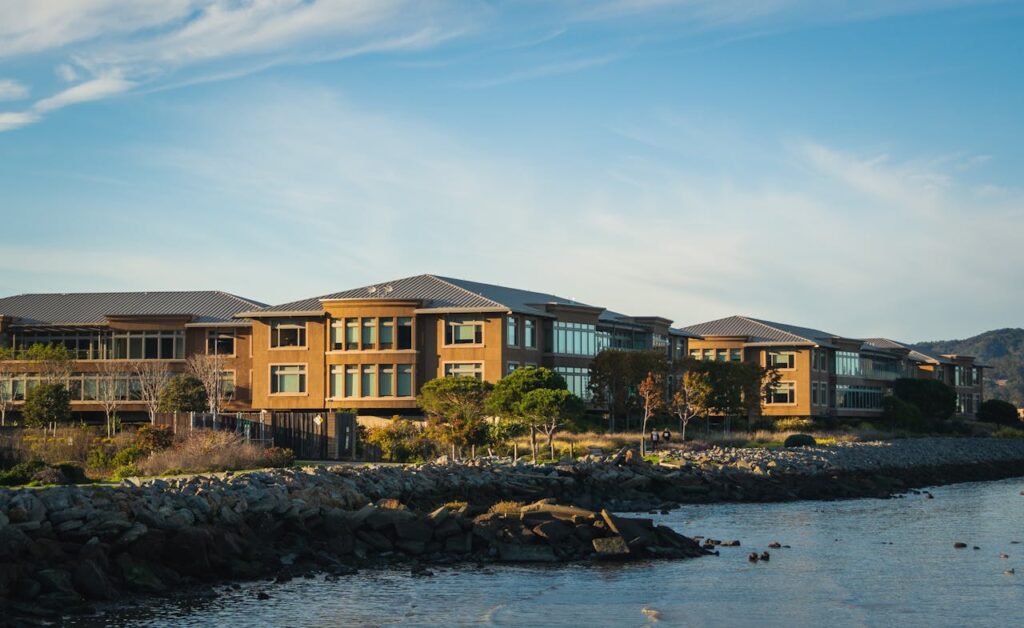 Stunning office complex located by the tranquil seashore with rocky coastline.