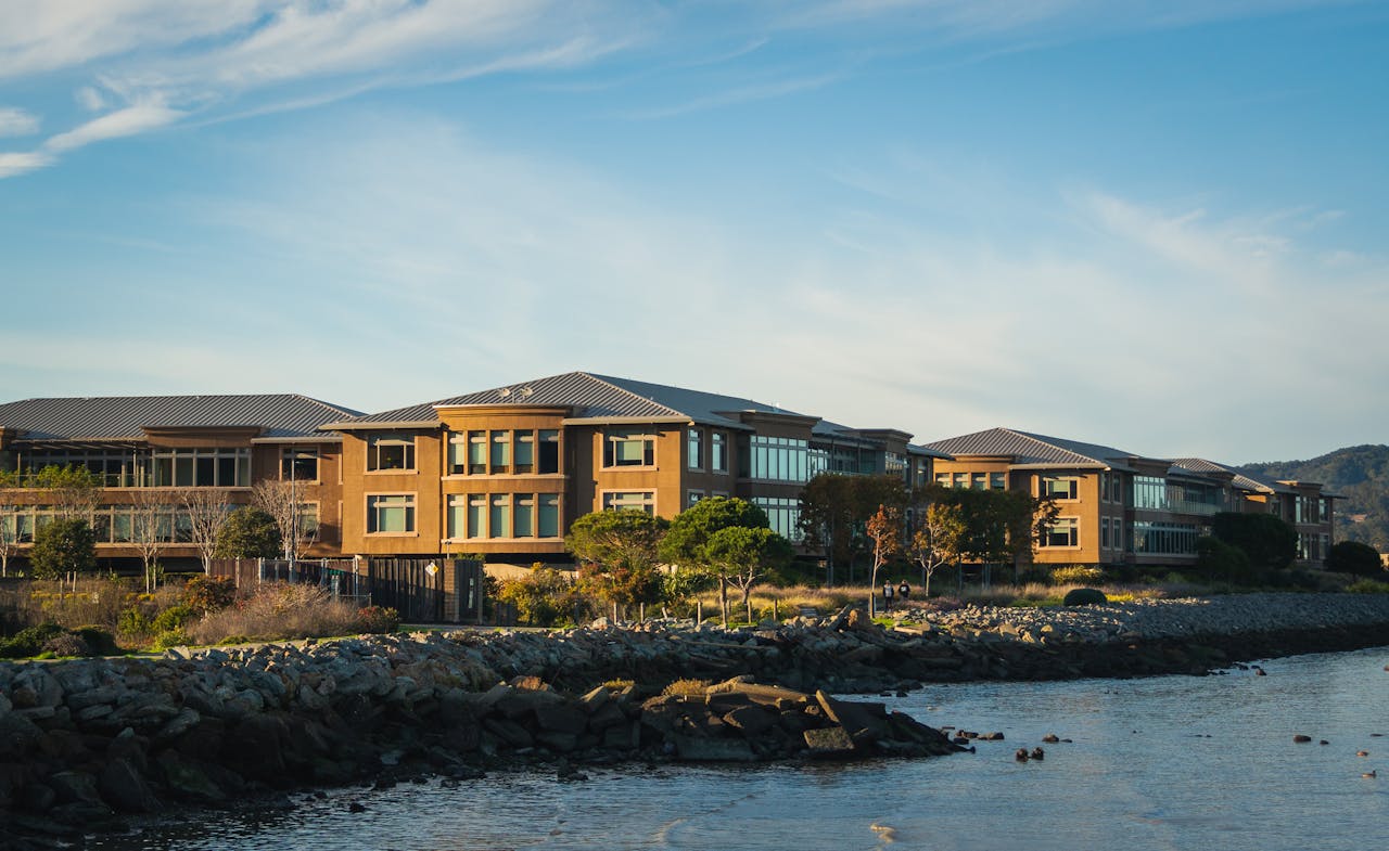 Stunning office complex located by the tranquil seashore with rocky coastline.