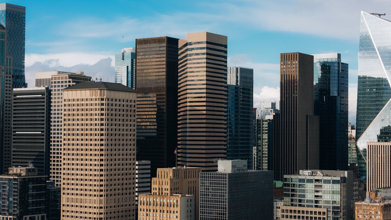 Aerial view of downtown Seattle skyscrapers under a clear blue sky.