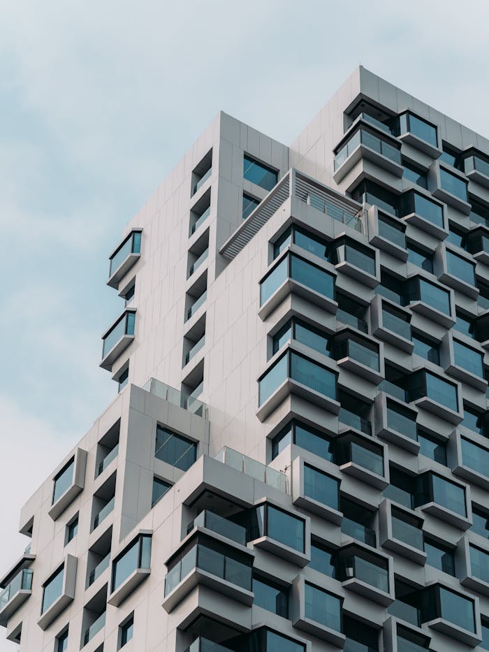 Contemporary architectural design featuring protruding windows on a high-rise building.