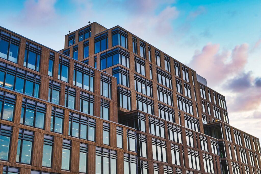 Exterior of big office building in modern design style under clear blue sky
